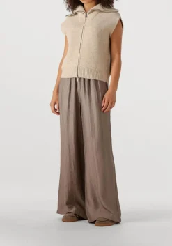 beige knit-ted vest may