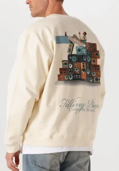 creme filling pieces sweater sweatshirt speaker wall